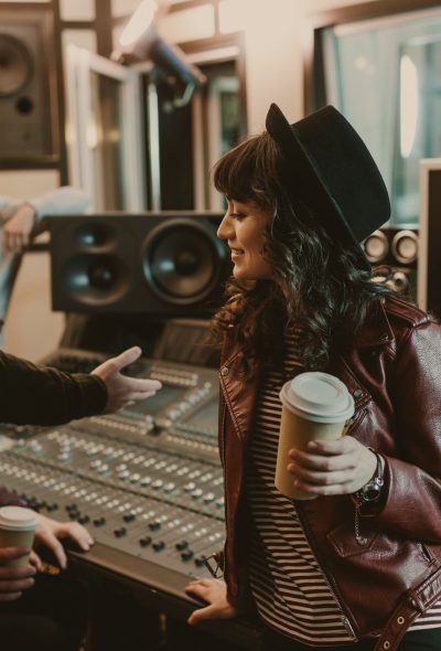 group of young musicians spending time at recording studio